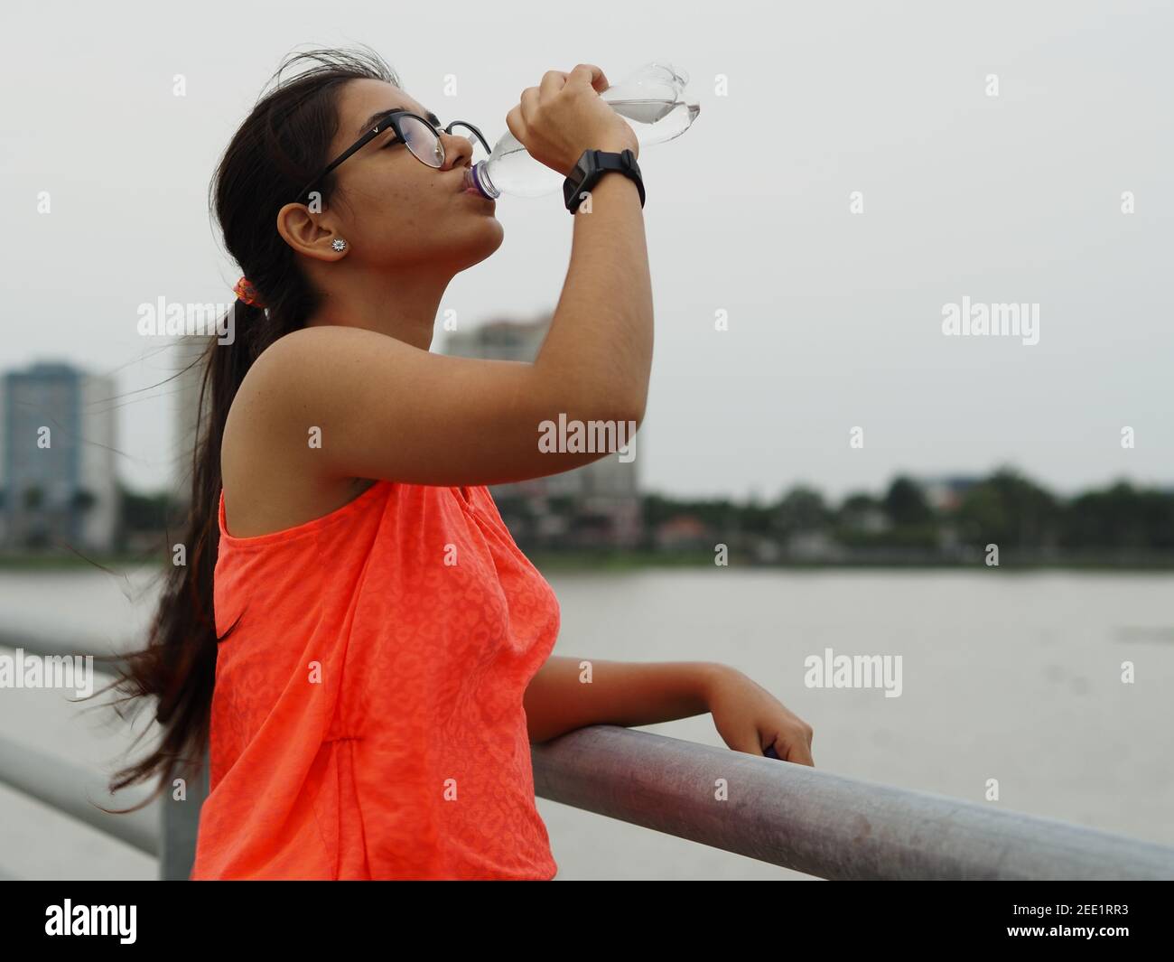 latin girl drinking water Stock Photo