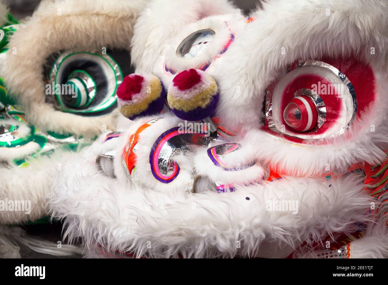 Close-up on two Lion's head costumes during the Guan Di Festival in Reunion Island. Stock Photo