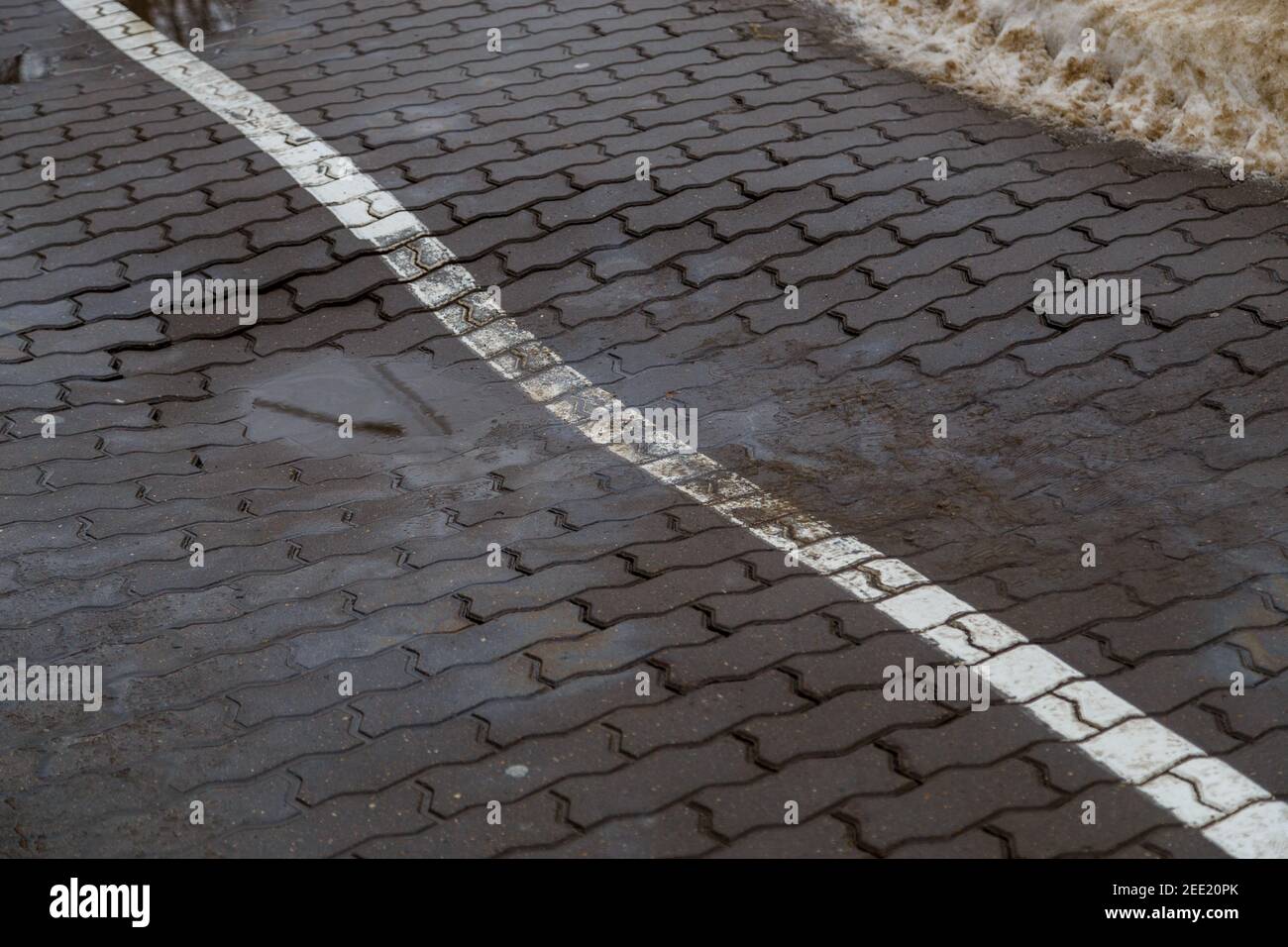 Footpath Defects pit defect on modern sidewalk gray concrete brick pavement with white ...