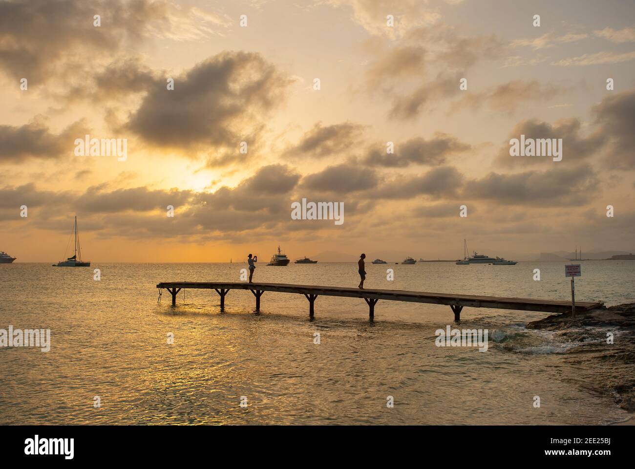 Jetty at sunset, Playa de ses illetes beach, Formentera, Balearics, Spain Stock Photo