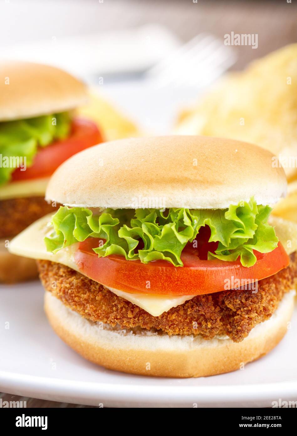 Mini Crispy Chicken Burger with Lettuce Tomato and Cheese Stock Photo Alamy