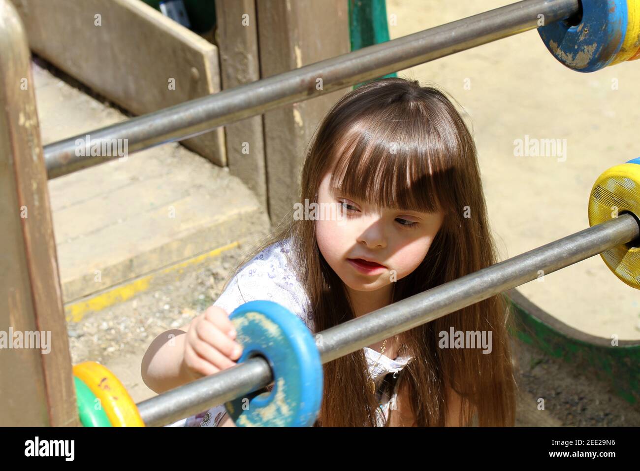 Portrait of beautiful young girl on the playground Stock Photo - Alamy