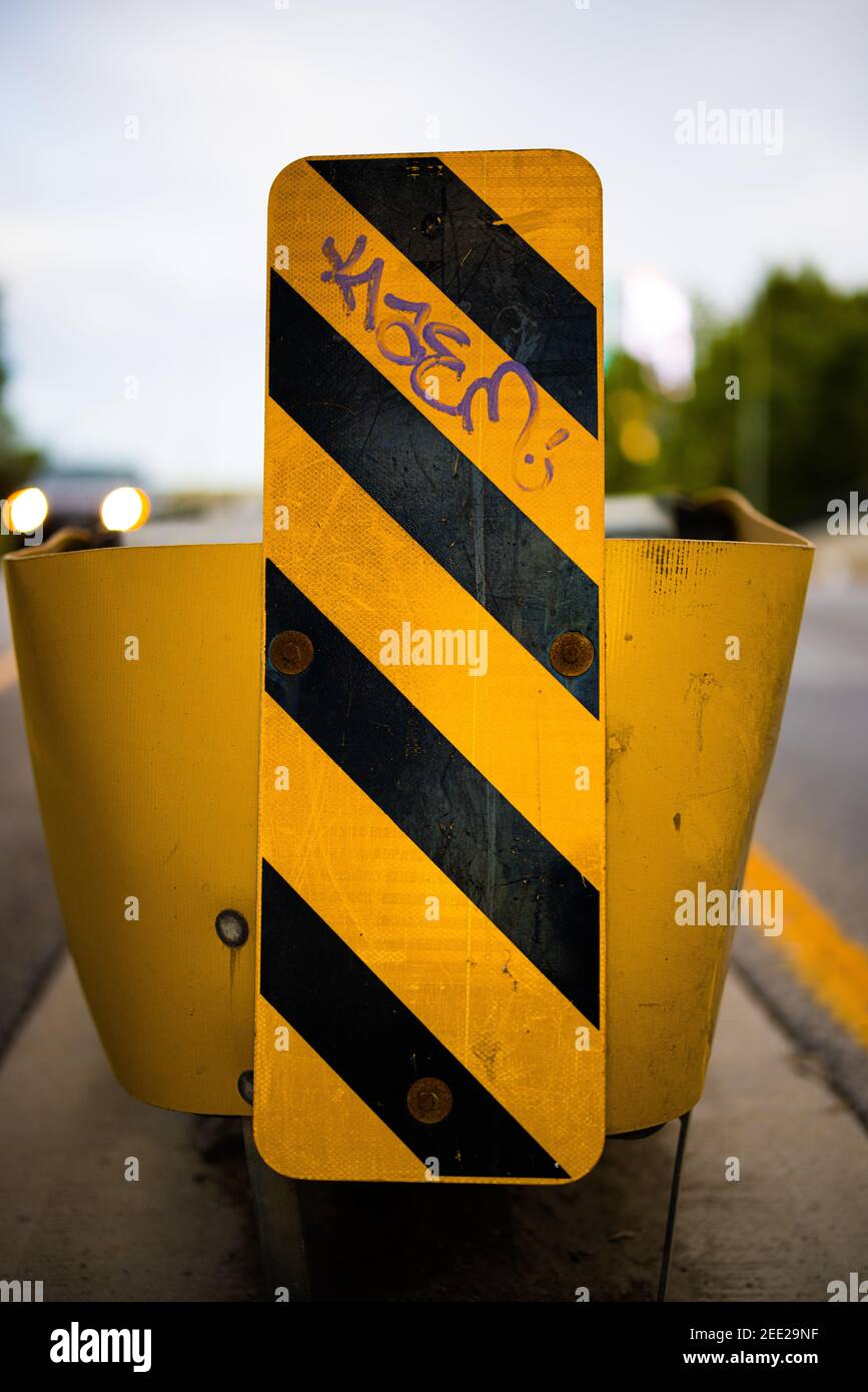 Yellow Traffic Barrier with Graffiti Tag Stock Photo Alamy