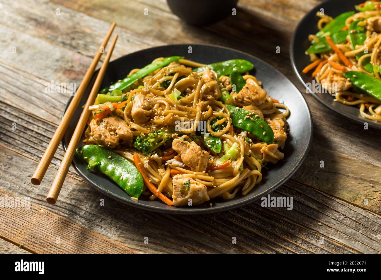 Homemade Asian Chicken Noodle Stir Fry with Fresh Veggies Stock Photo