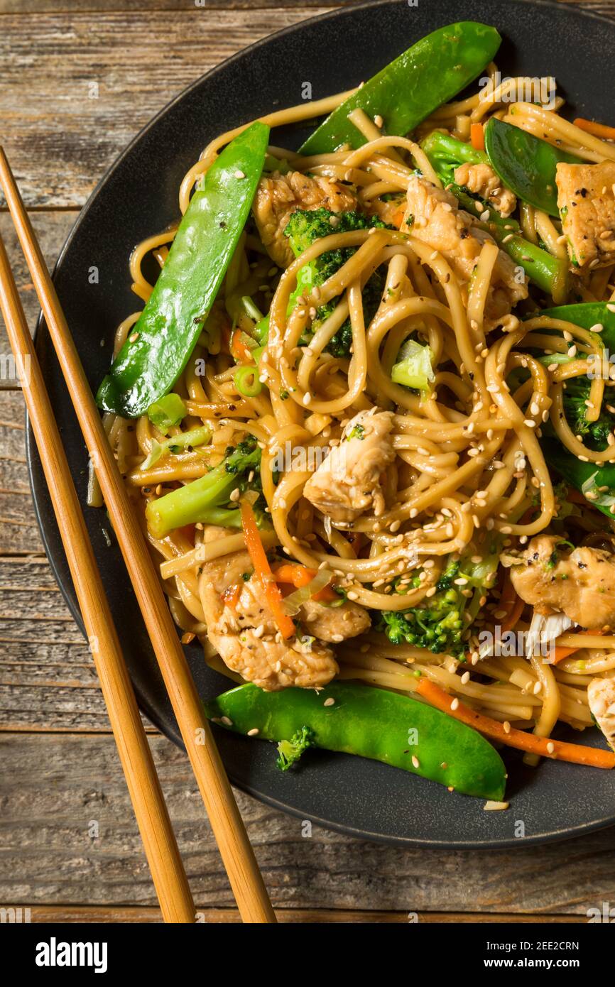 Homemade Asian Chicken Noodle Stir Fry with Fresh Veggies Stock Photo