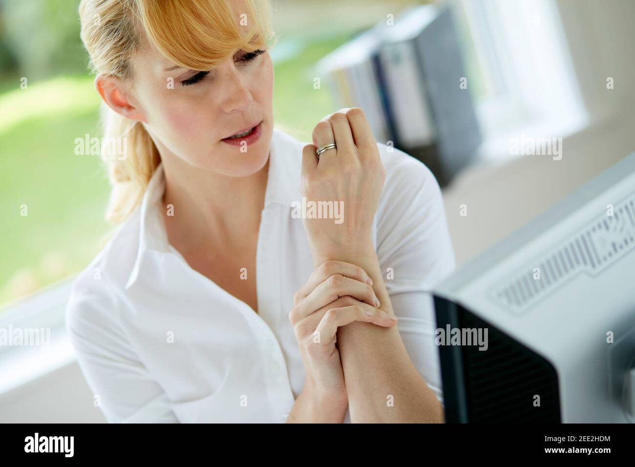 Woman holding her painful wrist Stock Photo