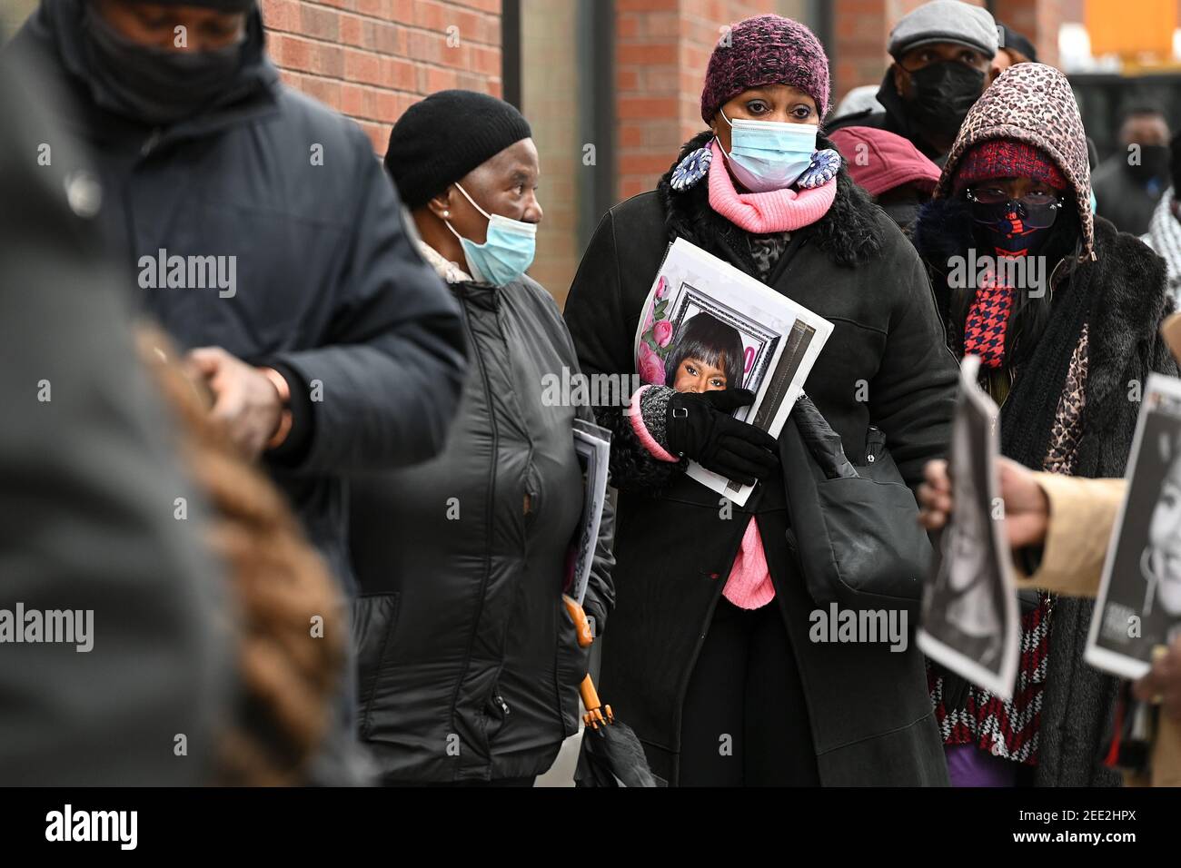 People wait in a long line for the public viewing of actress Cicely