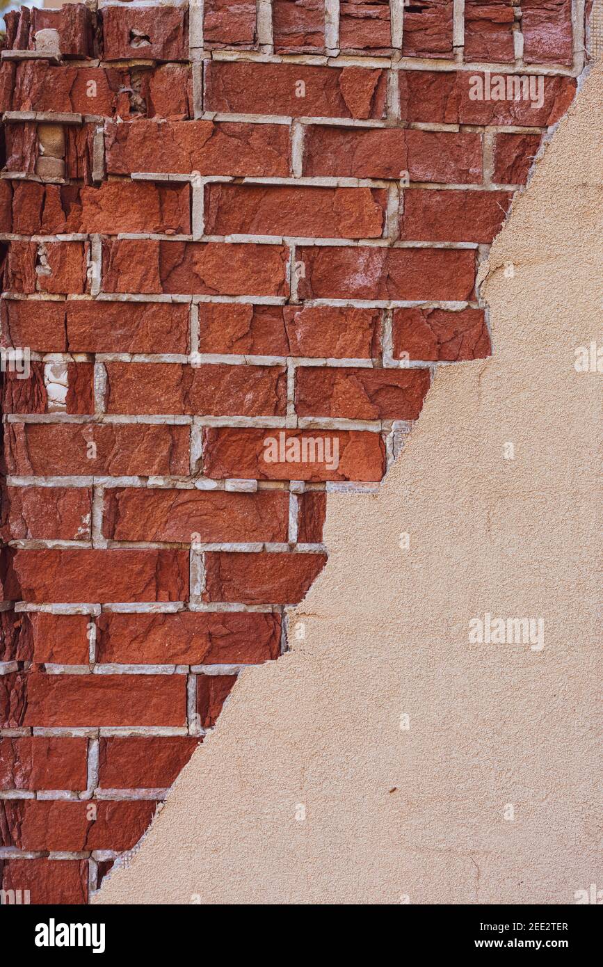 Red Brick Wall with Cracks Stock Photo
