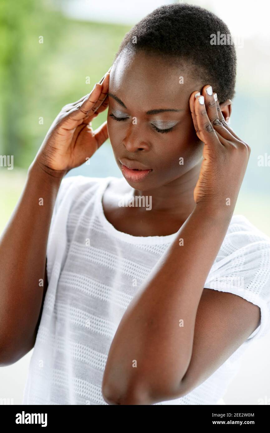 Stressed ethnic woman Stock Photo