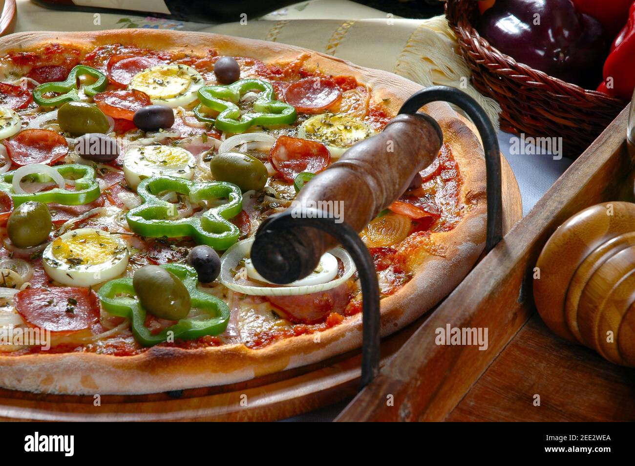 Portuguese Pizza, onion, peppers, pepperoni, egg, olive Stock Photo Alamy