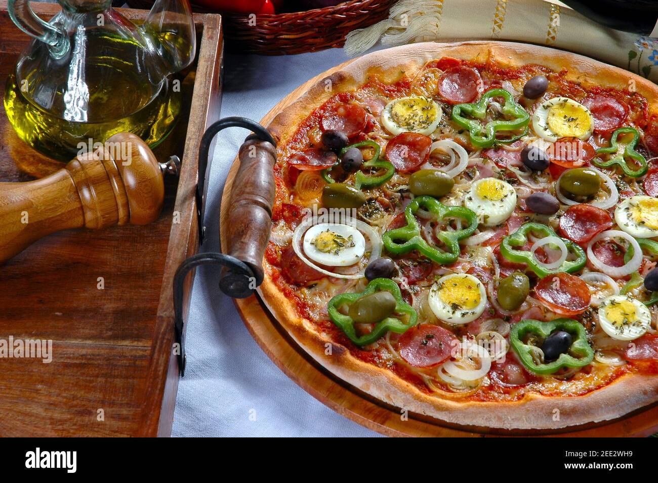 Portuguese Pizza, onion, peppers, pepperoni, egg, olive Stock Photo Alamy