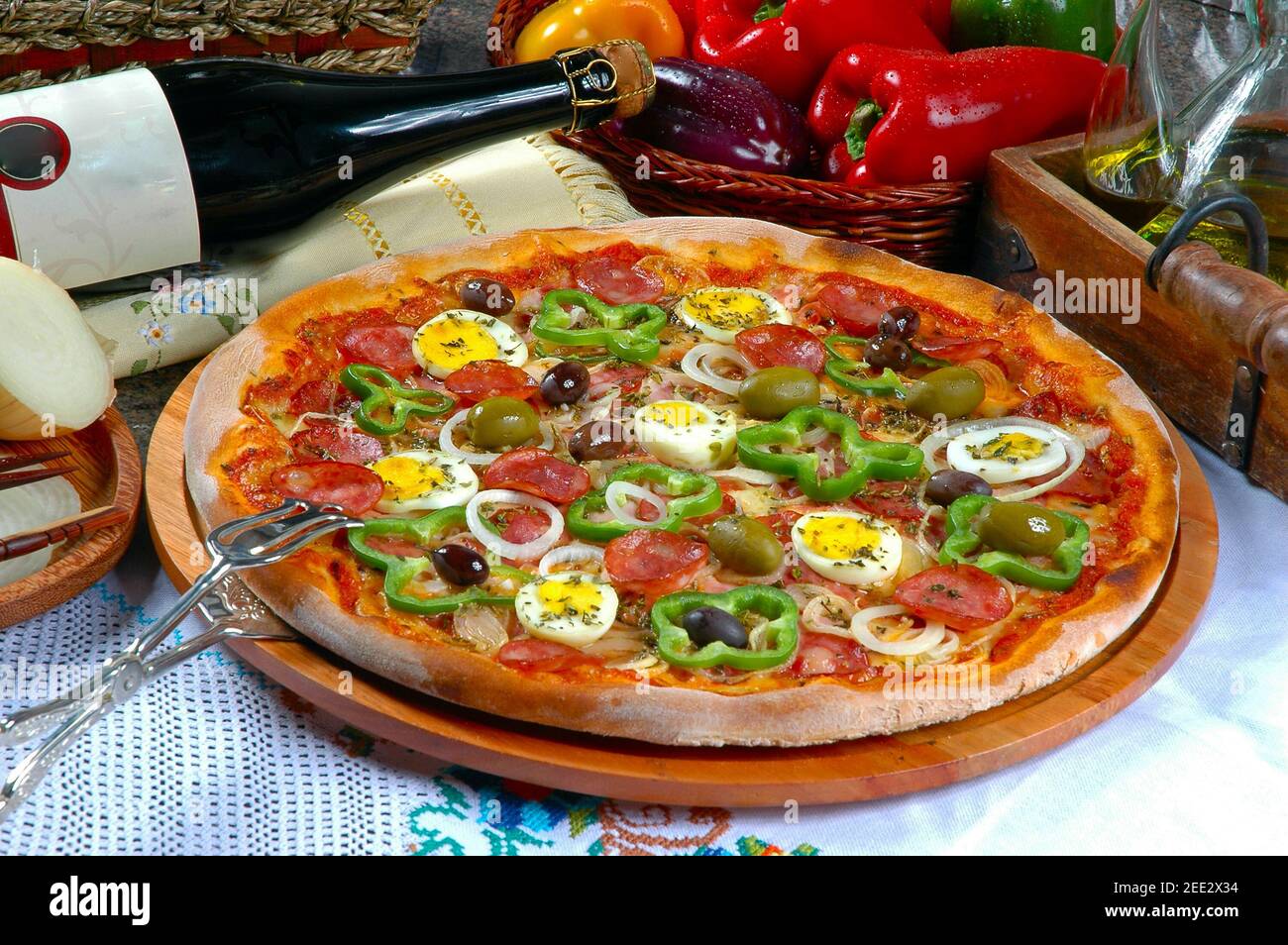 Portuguese Pizza, onion, peppers, pepperoni, egg, olive Stock Photo Alamy