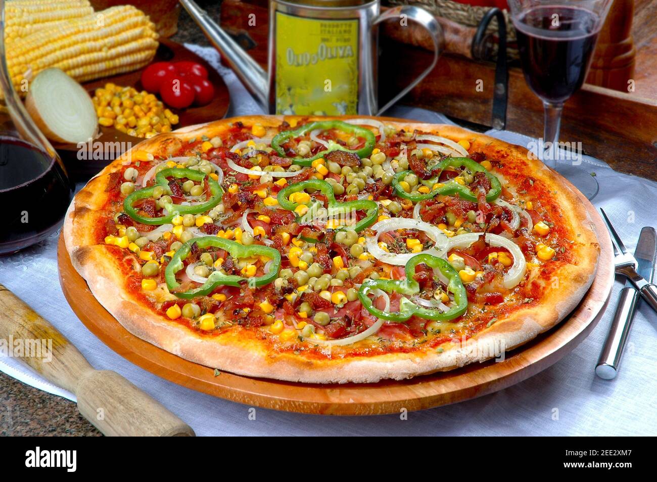 Pizza with corn, bacon, chili, onion, pea Stock Photo Alamy