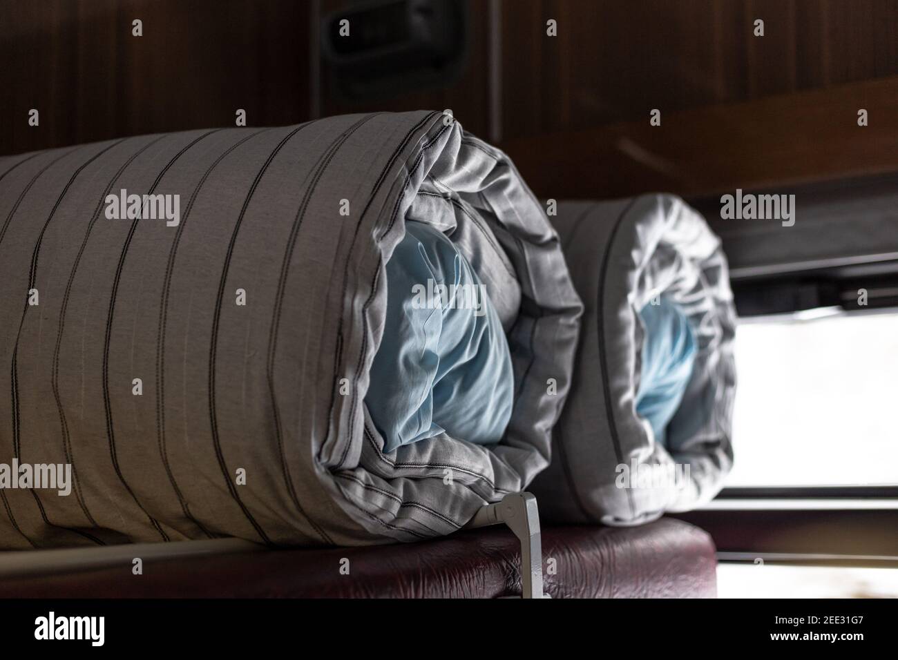 Mattress and pillow folded in the train carriage Stock Photo Alamy