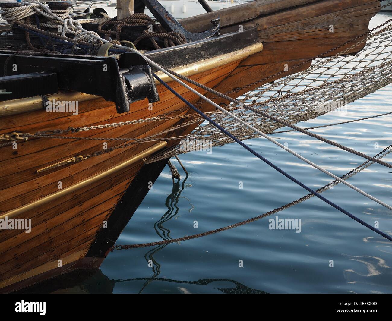 Bow of traditional wooden schooner at anchor in harbour Stock Photo Alamy