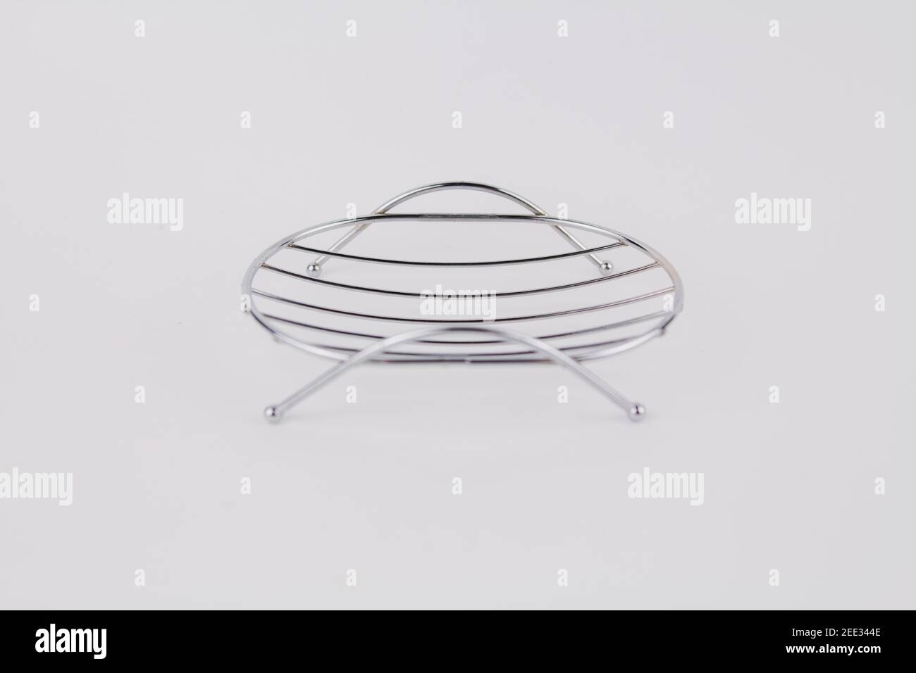 a metal soap dish on a white background Stock Photo