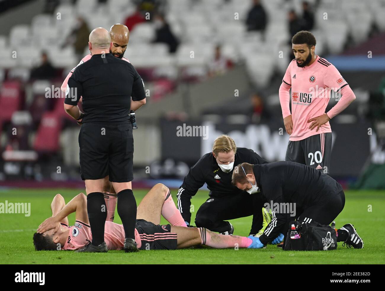 Sheffield United's John Egan receives treatment for an injury during