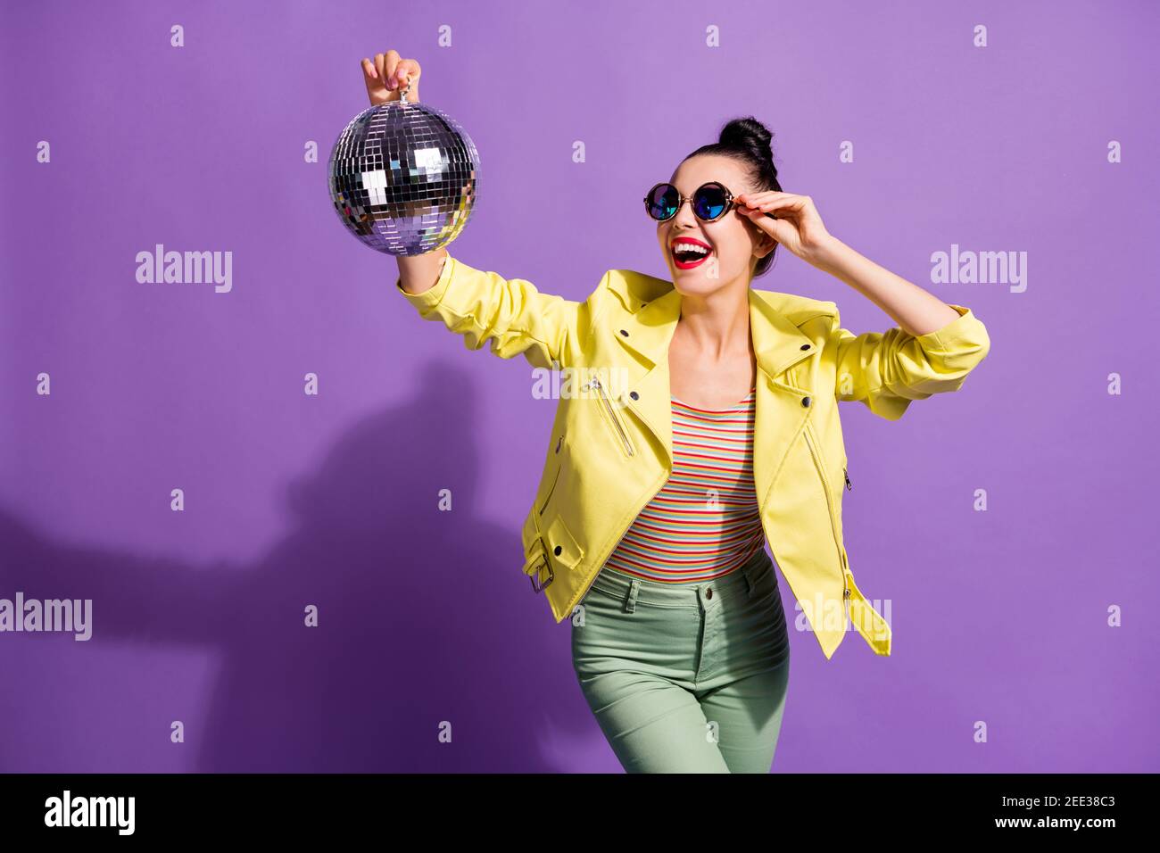Photo of excited crazy cool girl clubber look disco ball touch specs isolated over violet color background Stock Photo
