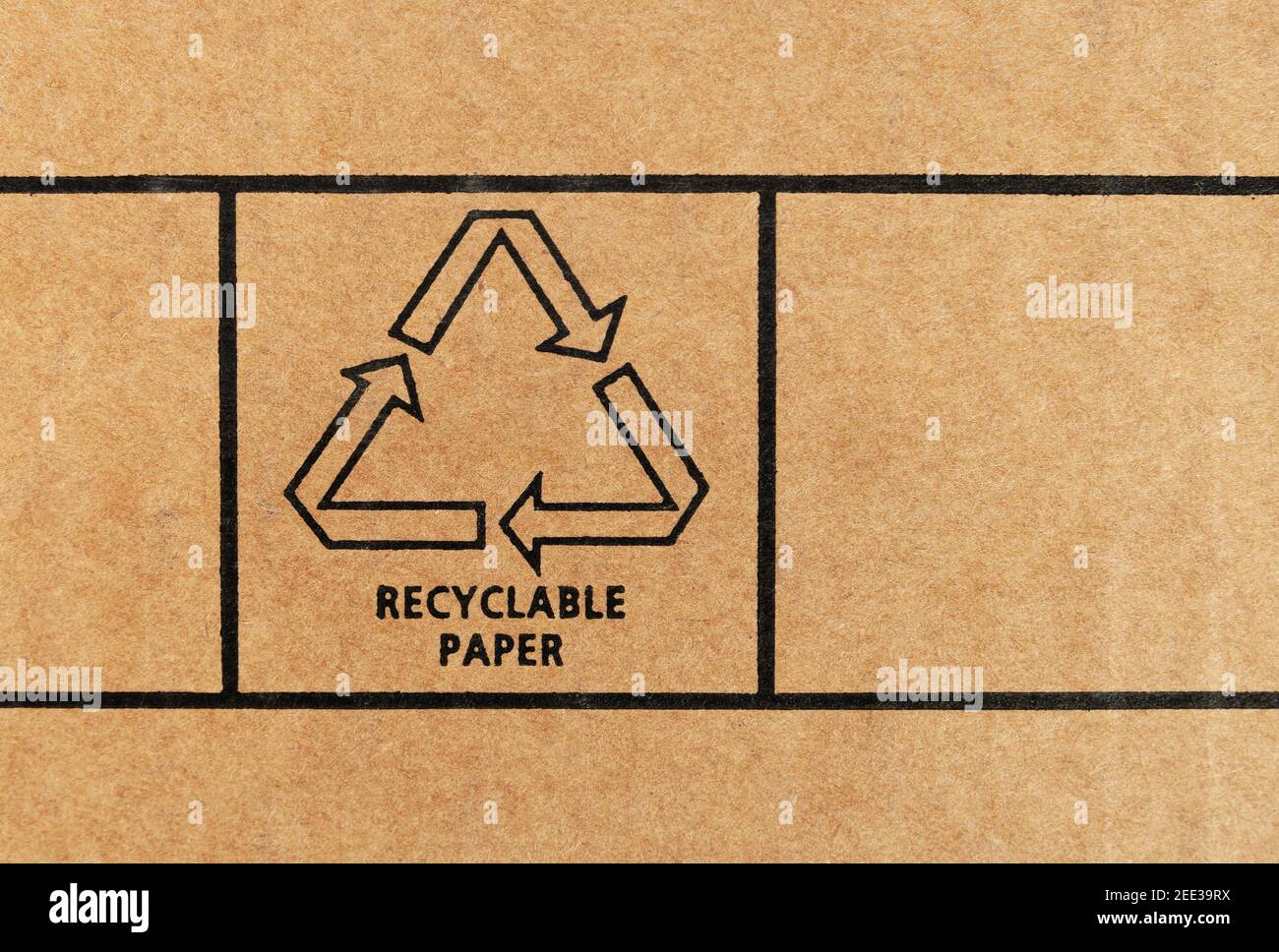 Sign of recyclable paper printed on recycled cardboard. Close up. Stock Photo