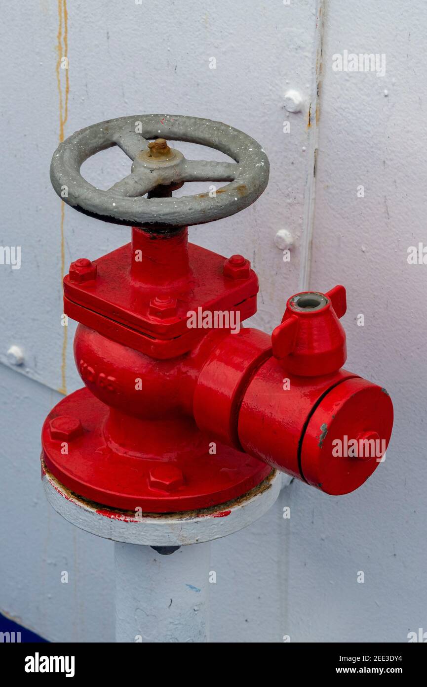 an old style handwheel fire hydrant on a ship for firefighting