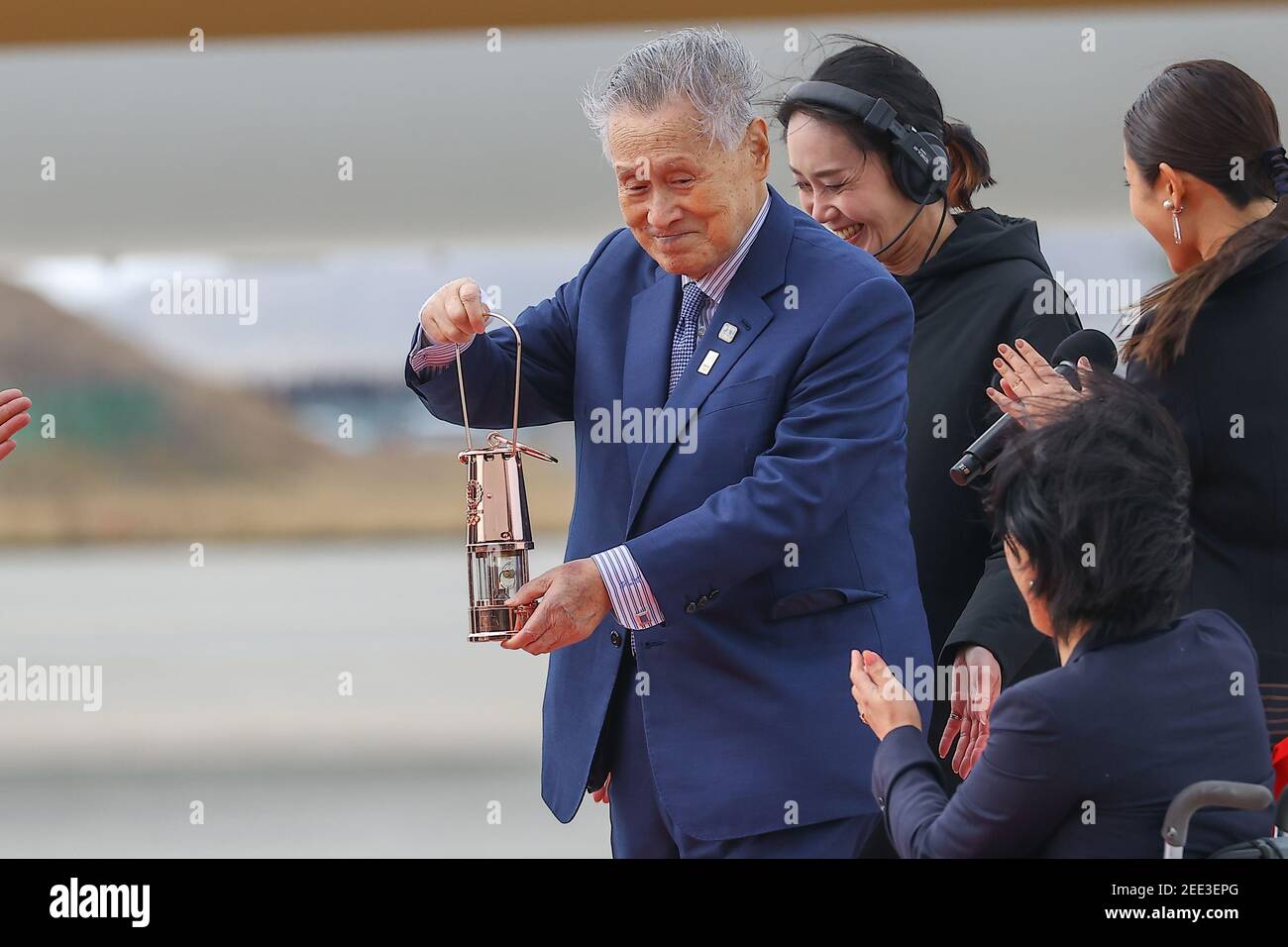 Miyagi, Japan. 20th Mar, 2020. Yoshiro Mori, chairman of the Tokyo Organizing Committee for the Olympic and Paralympic Games (Tokyo 2020), holds a torch seed at the Air Self-Defense Force's Matsushima Air Base in Miyagi, Japan. on March 20, 2020 in Miyagi, Japan. The games were originally set to begin July 24, 2020, but they have been delayed due to the Covid-19 pandemic. The games have been tentatively rescheduled for July 23, 2021. (Photo by Kazuki Oishi/Sipa USA)**Japan Out** Credit: Sipa USA/Alamy Live News Stock Photo