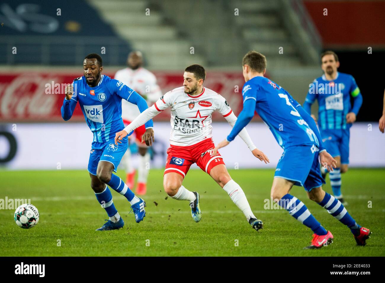 Gent's Elisha Owusu and Mouscron's Bruno Xadas Alexandre Vieira Almeida fight for the ball during a soccer match between KAA Gent and Royal Excel Mous Stock Photo