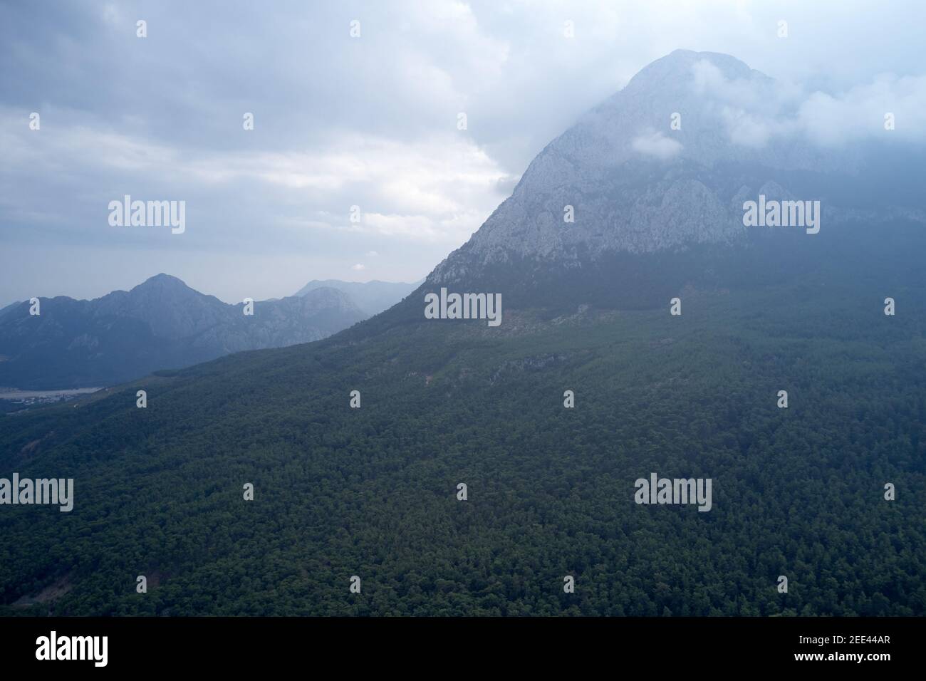 Green valley and mountains peak with clouds Stock Photo - Alamy