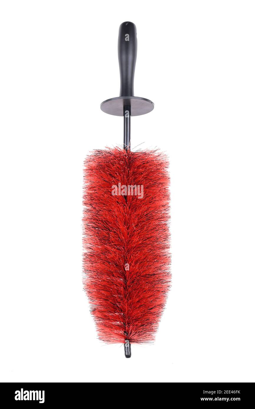 red coloured copper wire cleaning brush with black handle against a