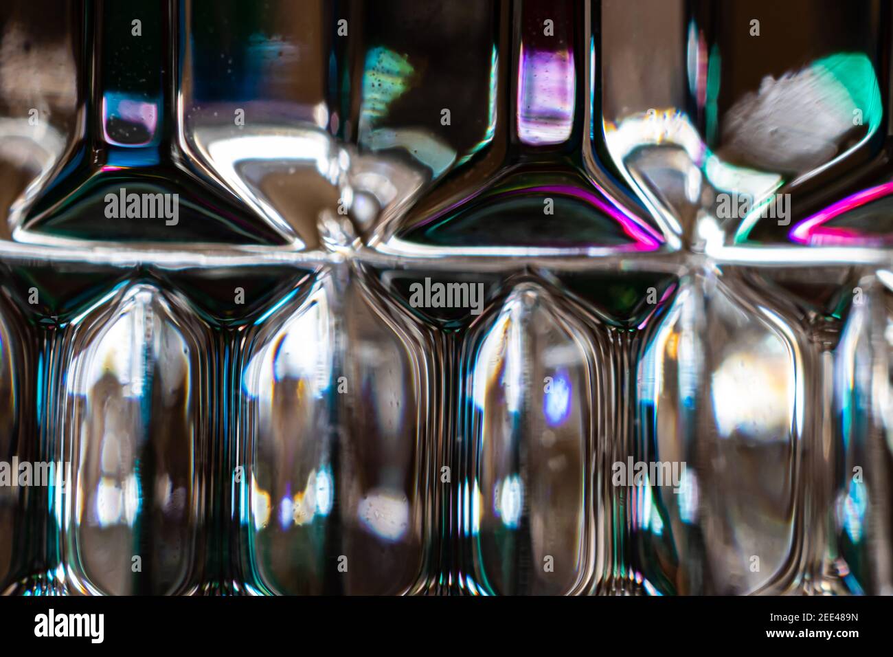 Getting very close to the refractions of light originating directly and from the candle holder Stock Photo