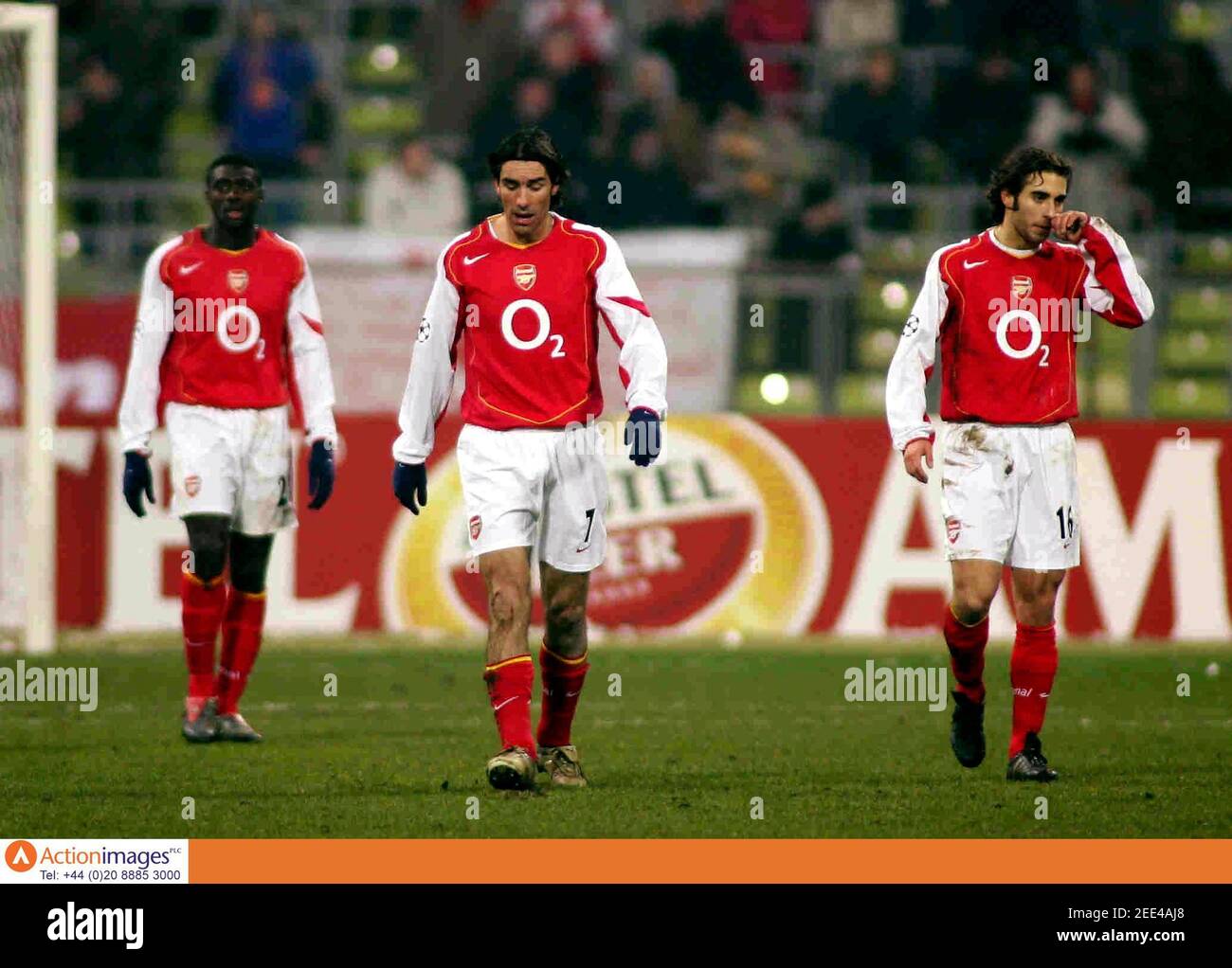 Football - Bayern Munich v Arsenal UEFA Champions League First Knockout  Round First Leg - Olympic Stadium, Munich - 22/2/05 Aresnal's Robert Pires,  Mathieu Flamini and Kolo Toure look dejected after Munich's