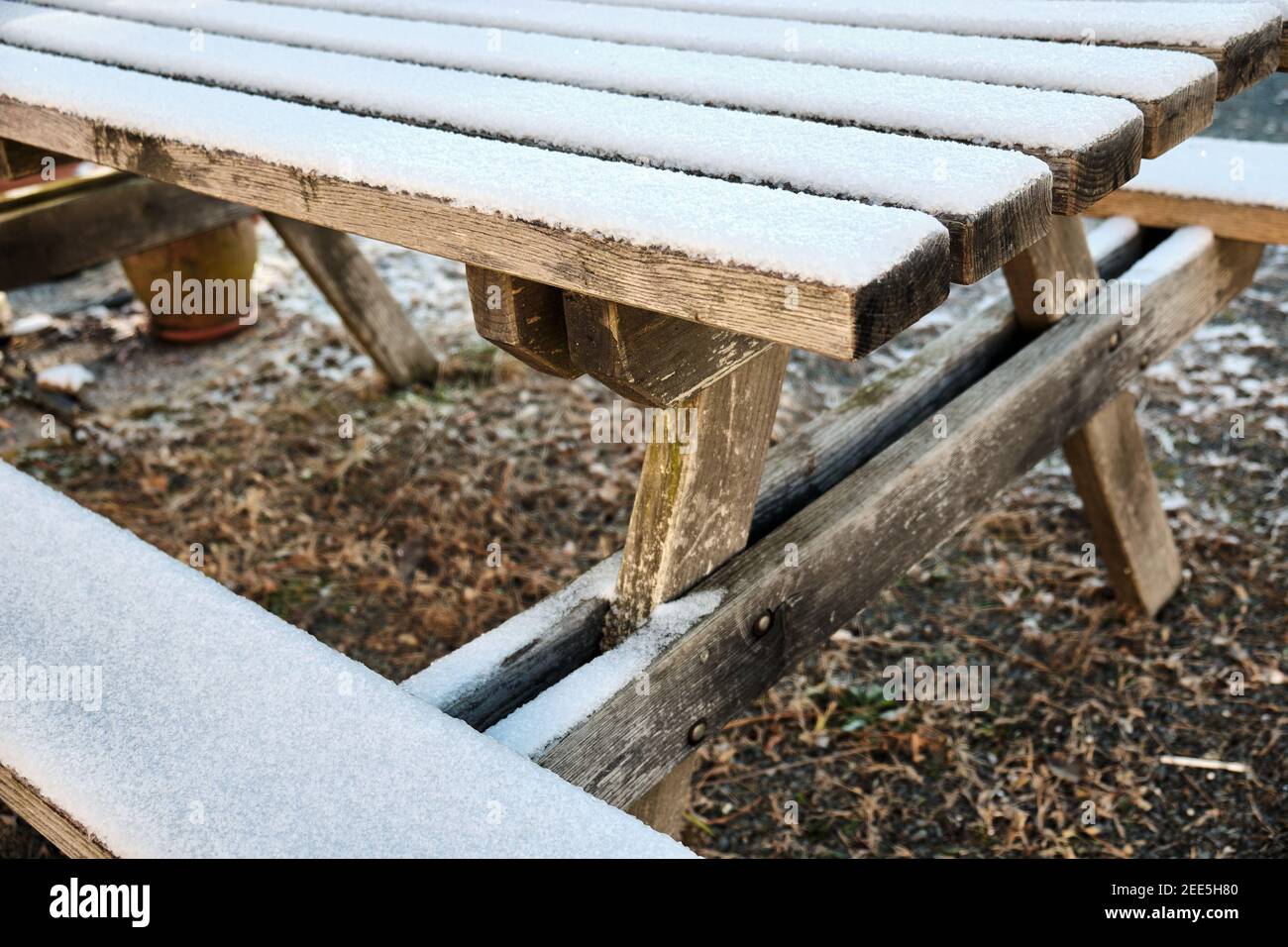 picnic table covered in fresh snow during winter Stock Photo