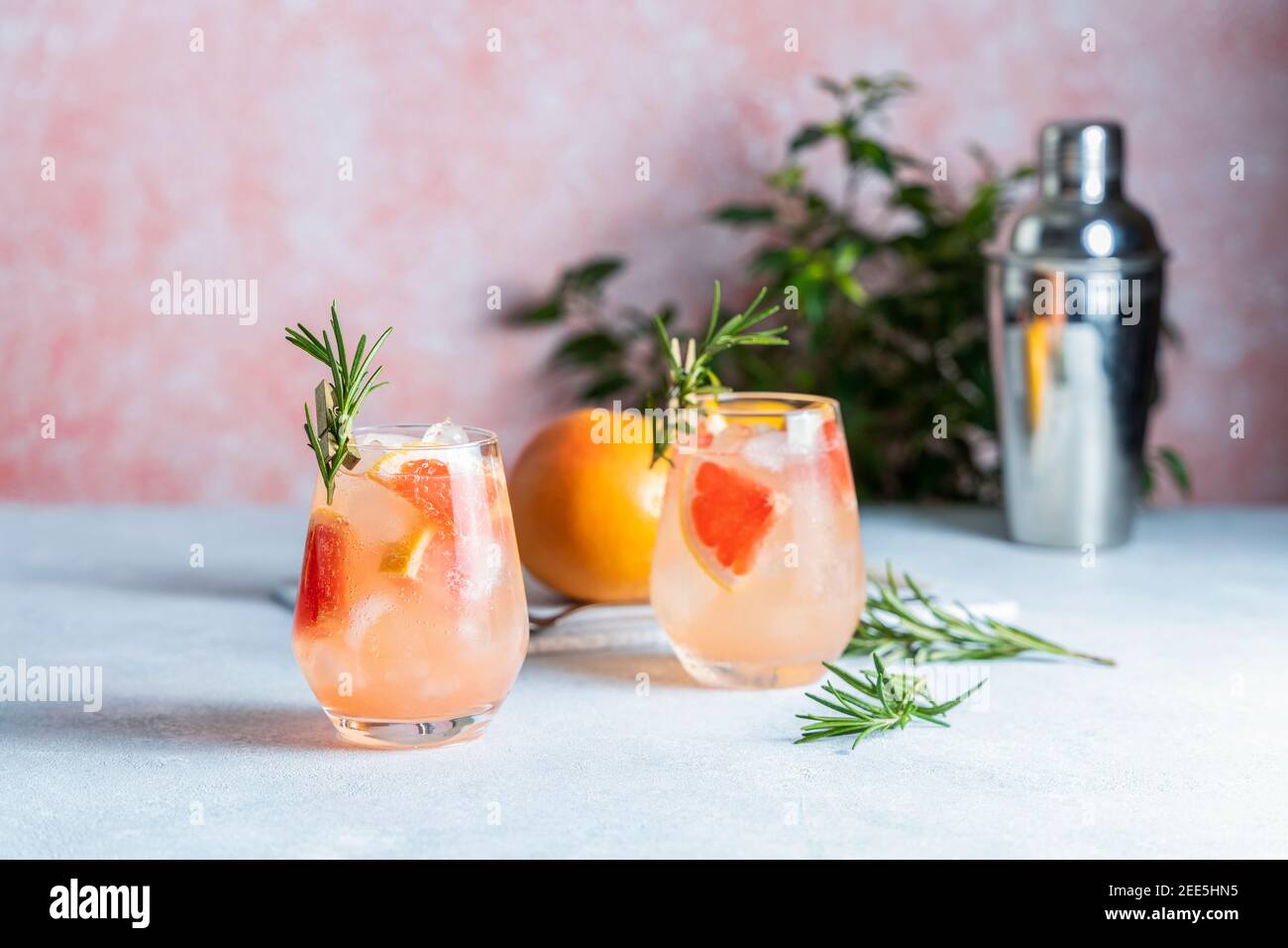 Tequila cocktail or cold lemonade with grapefruit juice, tinted with