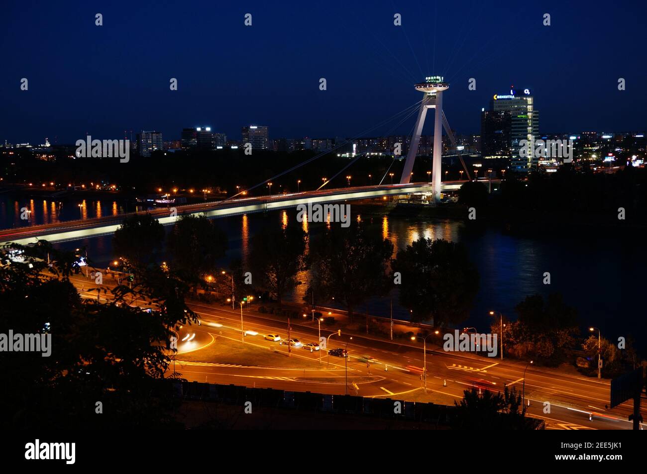 UFO tower and Bridge SNP over Danube river in Slovak capital city Bratislava at night Stock Photo