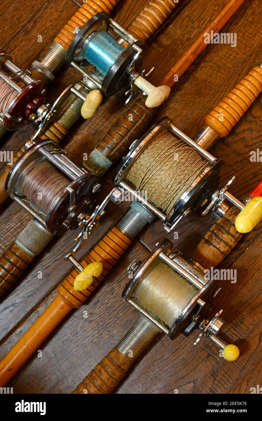 Vintage bamboo fishing rods and conventional reels Stock Photo