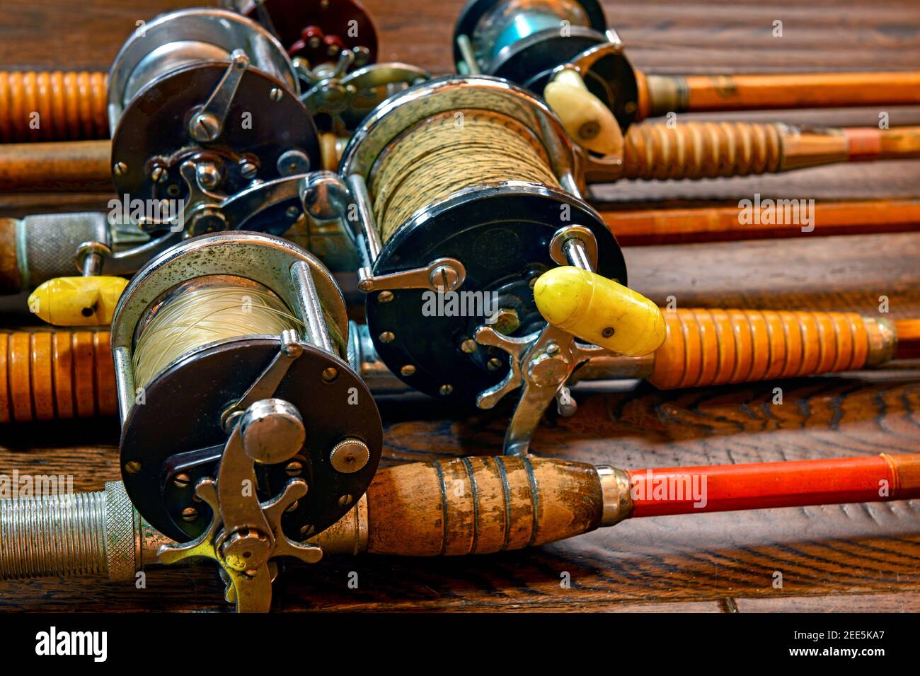 Vintage bamboo fishing rods and conventional reels Stock Photo - Alamy