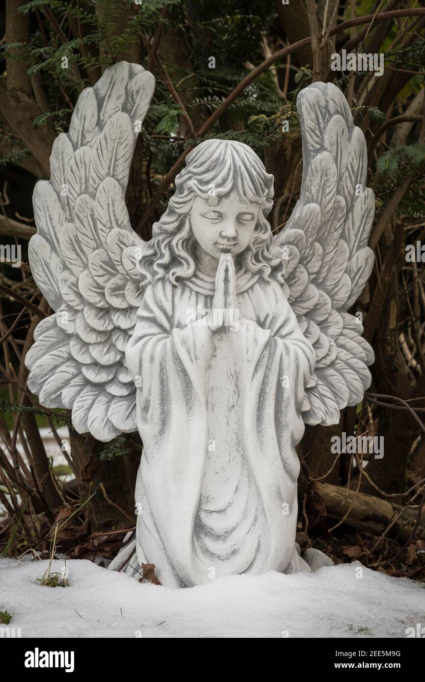 statue of angel in a cemetery Stock Photo
