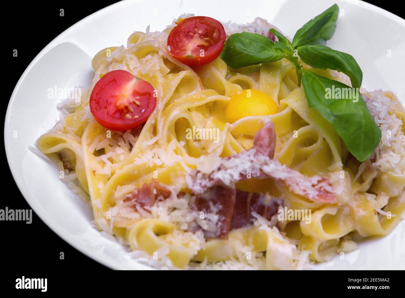 Pasta with bacon, cheese and tomato Stock Photo - Alamy
