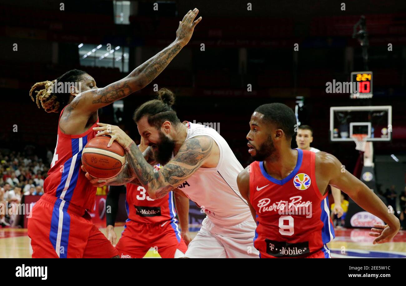 Basketball - FIBA World Cup - Second Round - Group J - Serbia v Puerto Rico - Wuhan Sports Centre, Wuhan, China - September 6, 2019  Serbia's Miroslav Raduljica in action with Puerto Rico's Renaldo Balkman and Gary Browne REUTERS/Jason Lee Stock Photo