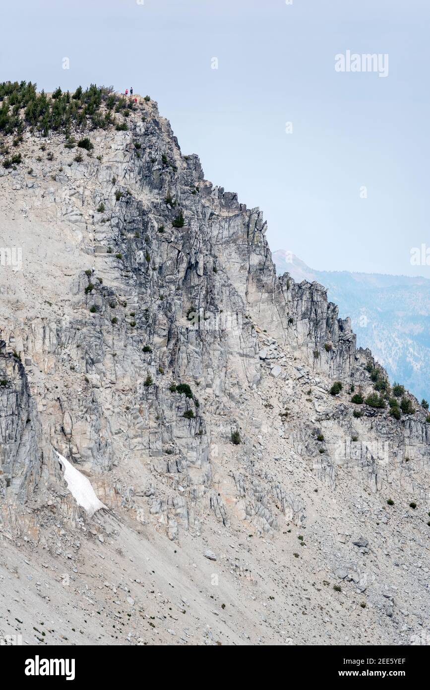 Hikers on the summit of Eagle Cap Peak in Oregon's Wallowa Mountains. Stock Photo