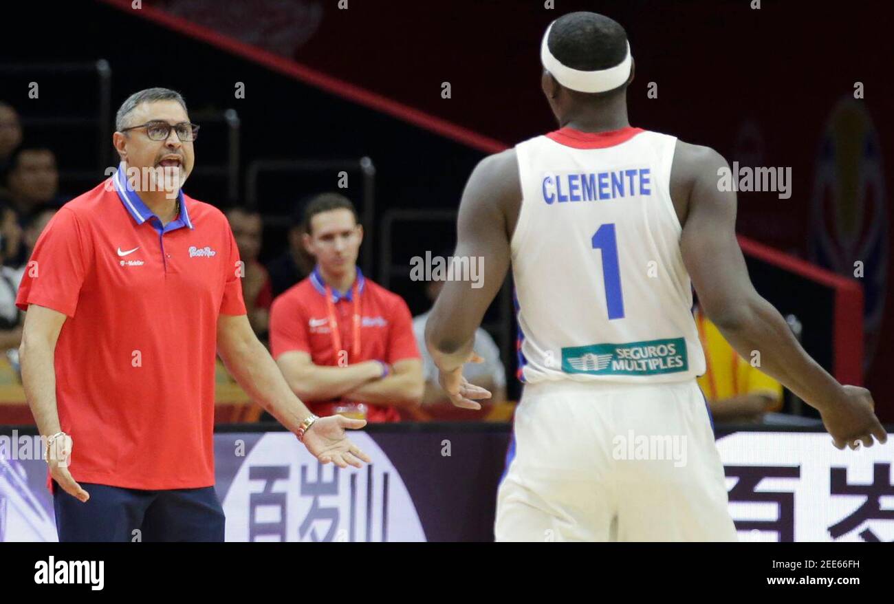 Basketball - FIBA World Cup - Second Round - Group J - Puerto Rico v Italy - Wuhan Sports Centre, Wuhan, China - September 8, 2019  Puerto Rico coach Eddle Casiano speaks with Puerto Rico's Ramon Clemente during the match REUTERS/Jason Lee Stock Photo