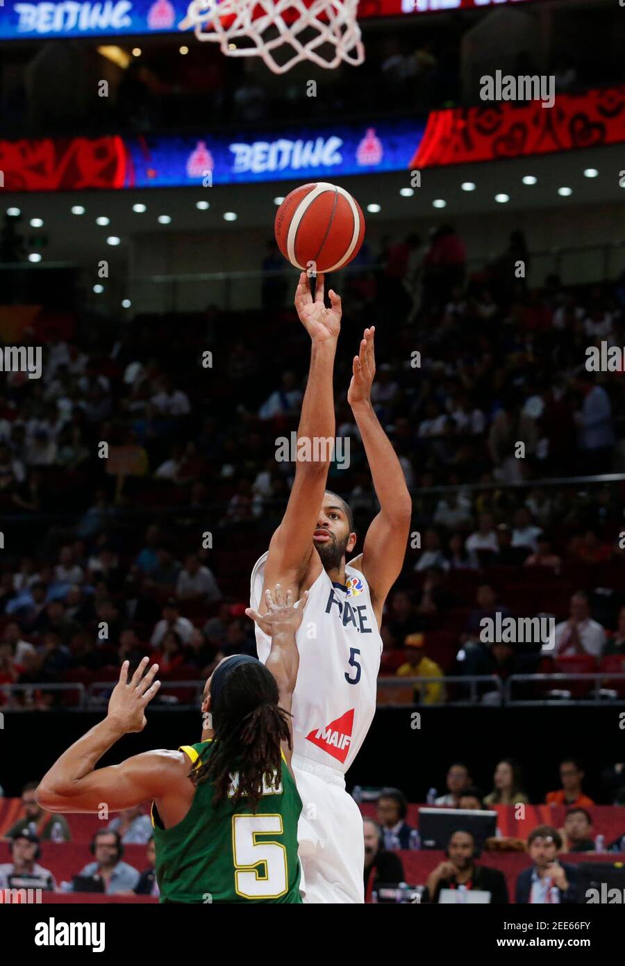 Basketball - FIBA World Cup - 3rd Place Game - France v Australia - Wukesong Sport Arena, Beijing, China - September 15, 2019  France's Nicolas Batum in action with Australia's Patty Mills REUTERS/Jason Lee Stock Photo