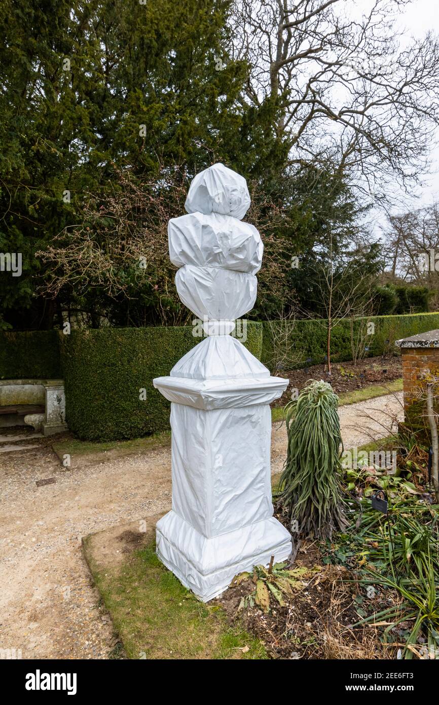 Statues and sculptures wrapped up in white plastic for protection