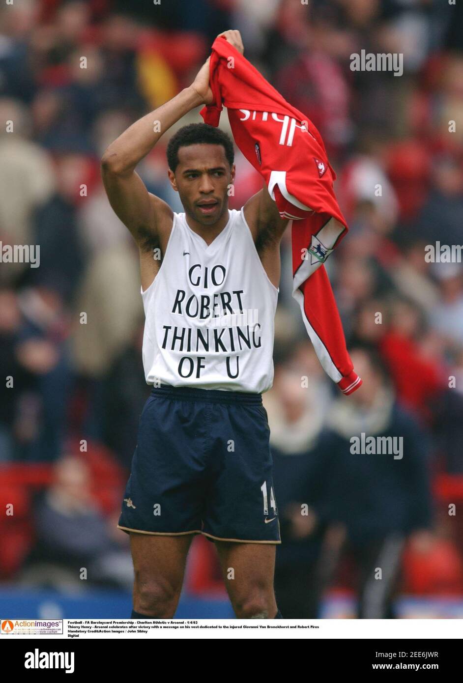 Football - FA Barclaycard Premiership - Charlton Athletic v Arsenal -  1/4/02 Thierry Henry - Arsenal celebrates after victory with a message on  his vest dedicated to the injured Giovanni Van Bronckhorst