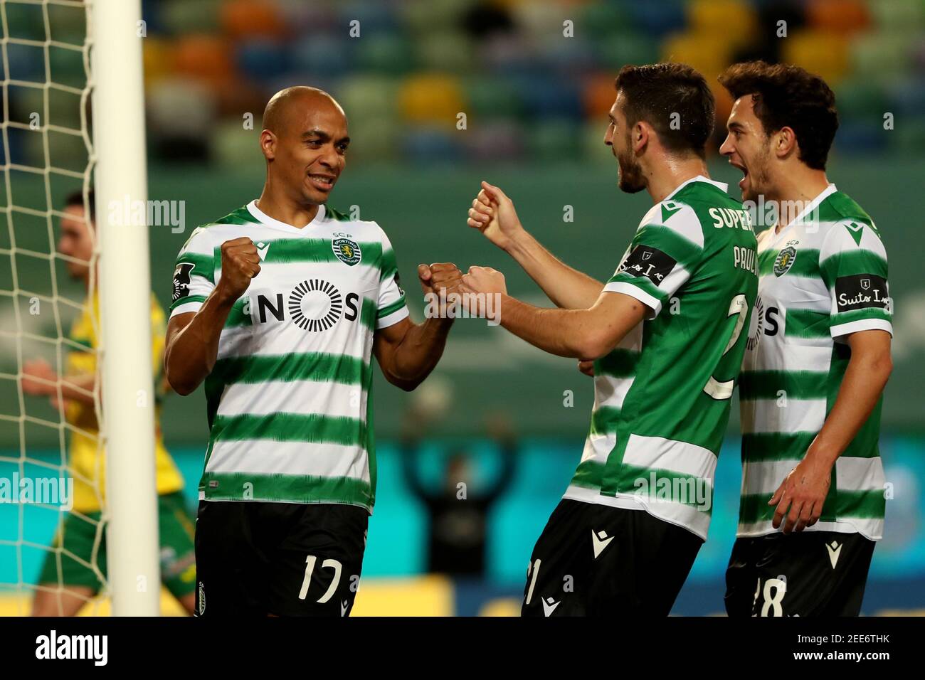 Lisbon, Portugal. 15th Feb, 2021. Joao Mario of Sporting CP (L) celebrates with teammates after scoring during the Portuguese League football match between Sporting CP and FC Pacos de Ferreira at Jose Alvalade stadium in Lisbon, Portugal on February 15, 2021. Credit: Pedro Fiuza/ZUMA Wire/Alamy Live News Stock Photo