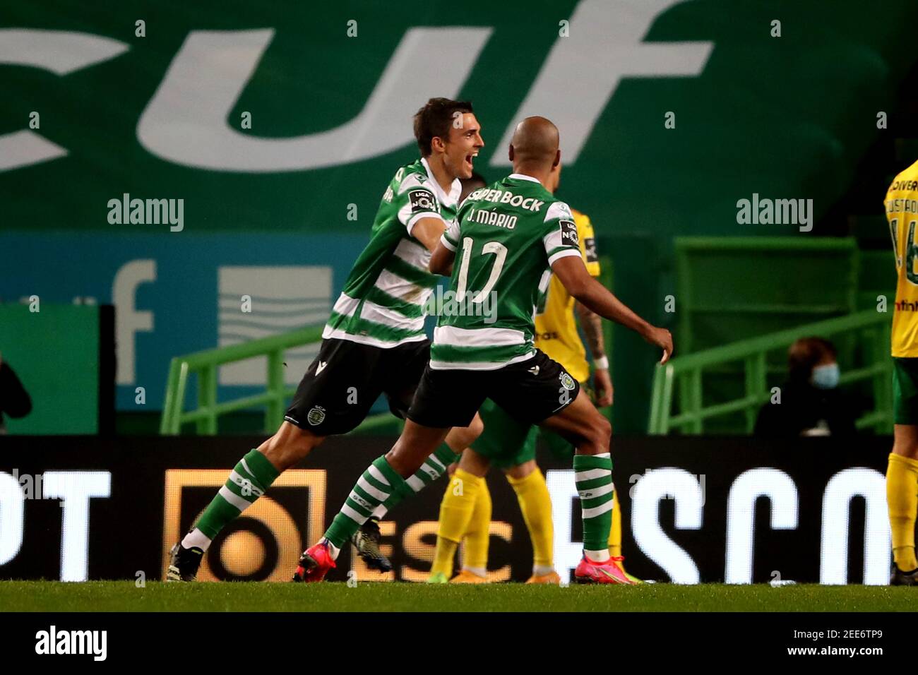 Lisbon, Portugal. 15th Feb, 2021. Joao Palhinha of Sporting CP (L ) celebrates with Joao Mario after scoring during the Portuguese League football match between Sporting CP and FC Pacos de Ferreira at Jose Alvalade stadium in Lisbon, Portugal on February 15, 2021. Credit: Pedro Fiuza/ZUMA Wire/Alamy Live News Stock Photo