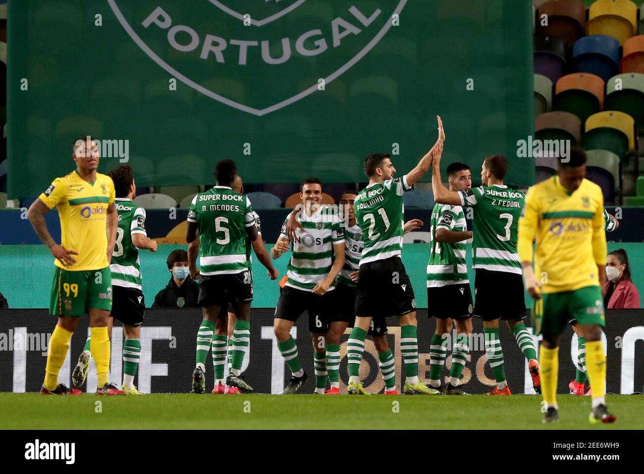 Lisbon, Portugal. 15th Feb, 2021. Joao Palhinha of Sporting CP (6) celebrates with teammates after scoring during the Portuguese League football match between Sporting CP and FC Pacos de Ferreira at Jose Alvalade stadium in Lisbon, Portugal on February 15, 2021. Credit: Pedro Fiuza/ZUMA Wire/Alamy Live News Stock Photo