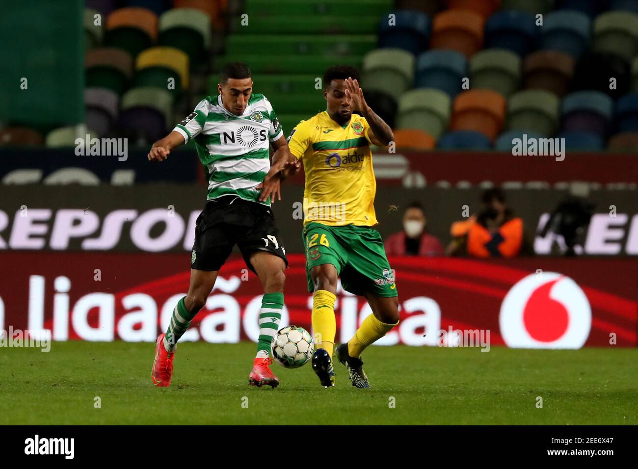 Lisbon, Portugal. 15th Feb, 2021. Tiago Tomas of Sporting CP (L) vies with Maracas of FC Pacos Ferreira during the Portuguese League football match between Sporting CP and FC Pacos de Ferreira at Jose Alvalade stadium in Lisbon, Portugal on February 15, 2021. Credit: Pedro Fiuza/ZUMA Wire/Alamy Live News Stock Photo