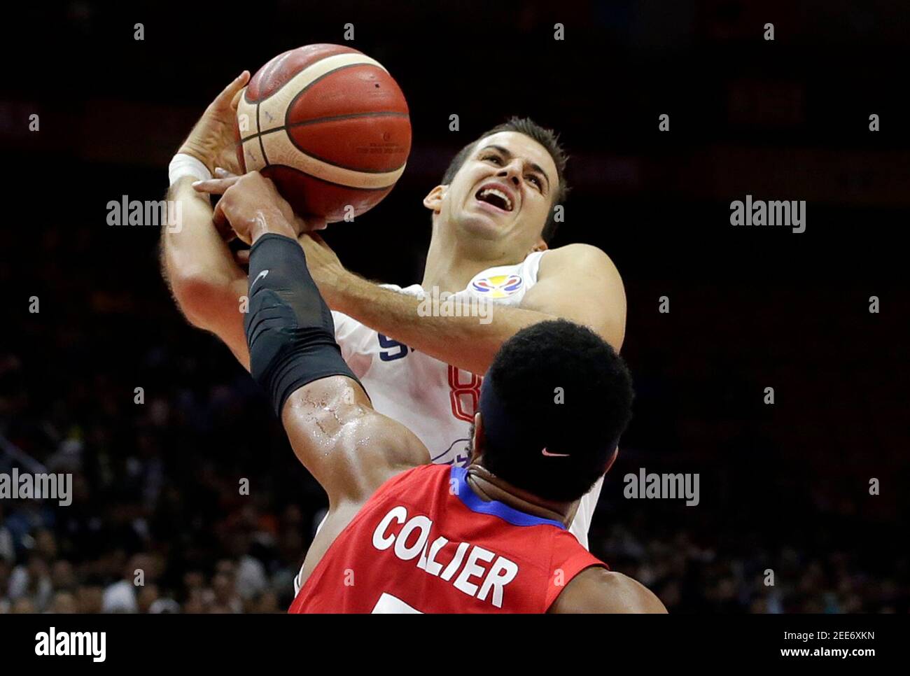Basketball - FIBA World Cup - Second Round - Group J - Serbia v Puerto Rico - Wuhan Sports Centre, Wuhan, China - September 6, 2019  Serbia's Nemanja Bjelica in action with Puerto Rico's Devon Collier REUTERS/Jason Lee Stock Photo