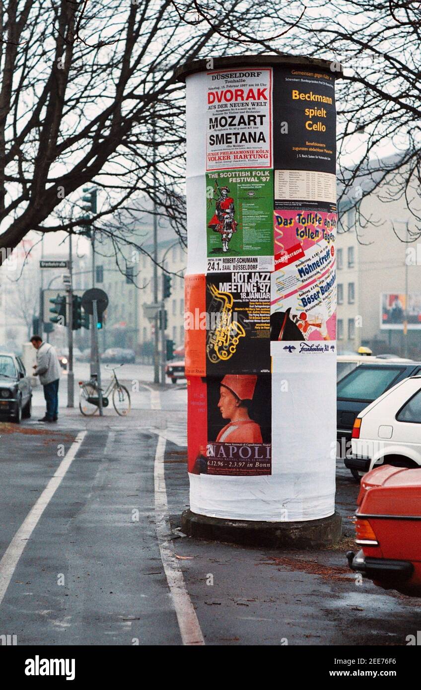AJAXNETPHOTO. DUSSELDORF, GERMANY. - POSTER DISPLAY - A LITFASSAULE CYLINDRICAL ADVERTISING COLUMN, A MARKETING DEVICE INVENTED IN GERMANY BY ERNST LITFASS IN 1854 AND BY GABRIEL MORRIS IN FRANCE IN 1868.PHOTO:JONATHAN EASTLAND/AJAX REF:TC6065 21 35 Stock Photo