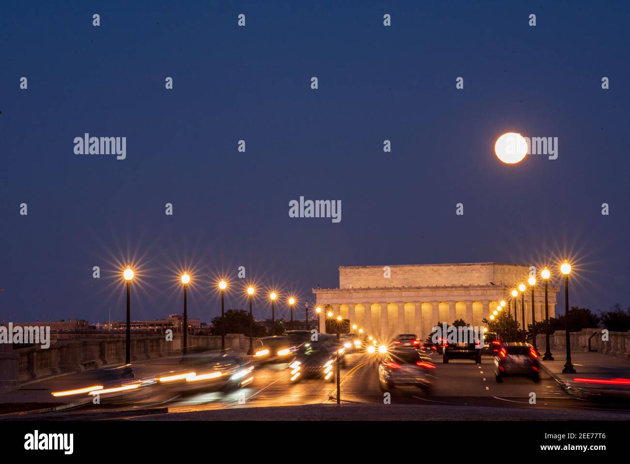 The full moon rises above Arlington Memorial Bridge and The Lincoln Memorial. Series 7 of 7. Stock Photo